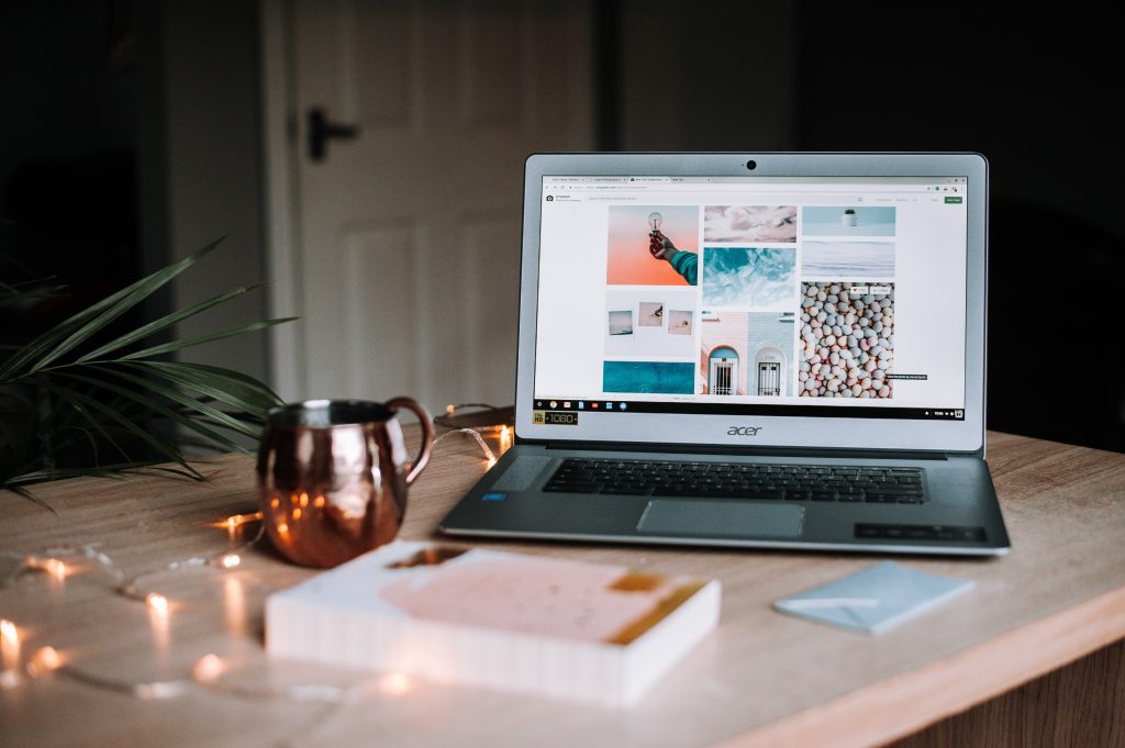 computer at desk with copper cup